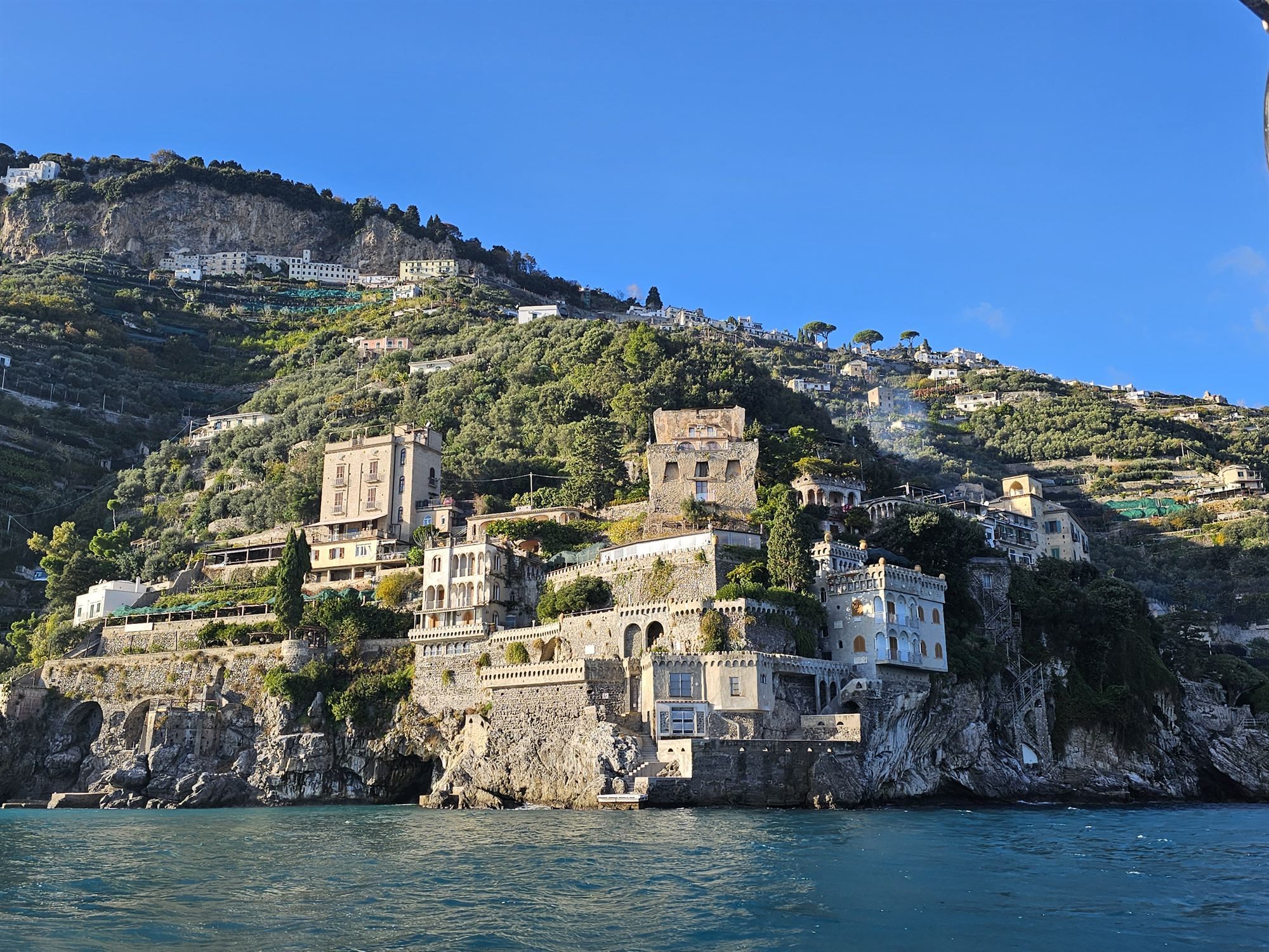 A cliffside villa seen from the boat along the Amalfi Coast