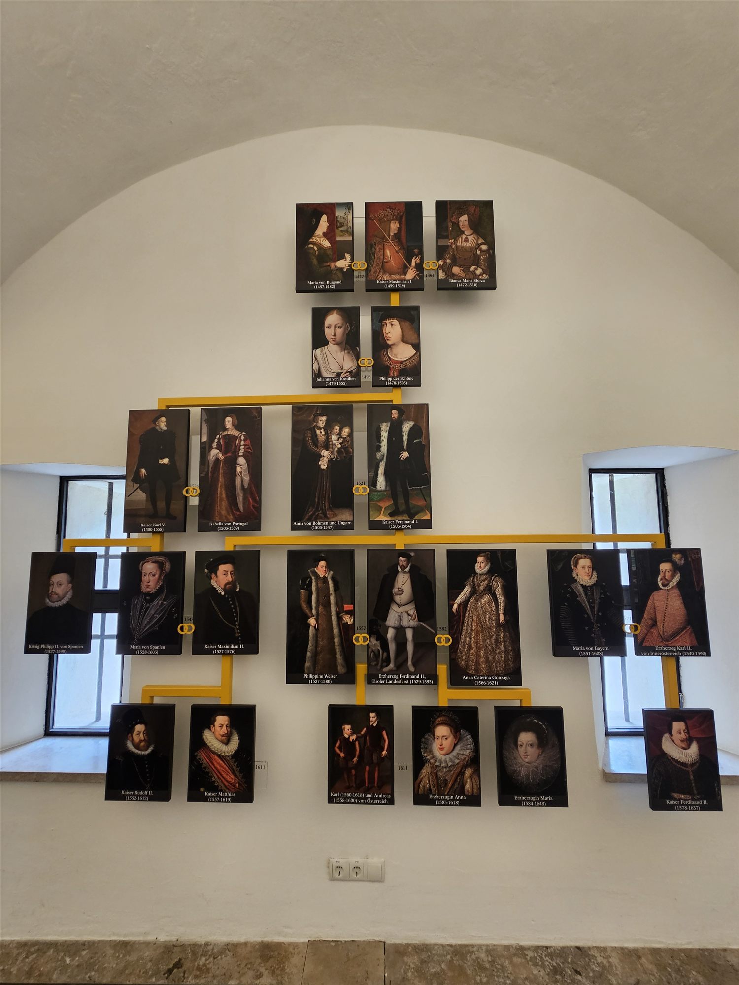 The Habsburg family tree display at Ambras Castle, showing Philippine Welser and Archduke Ferdinand II