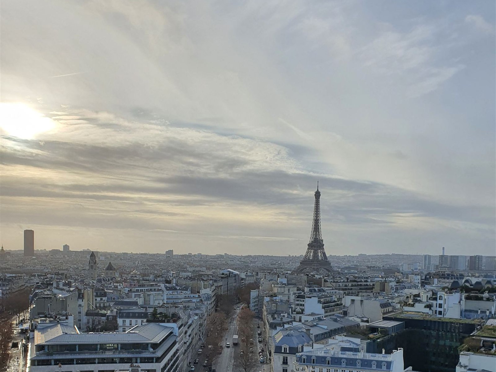 View over Paris from the top of the Arc de Triomphe, with the Eiffel Tower in the distance