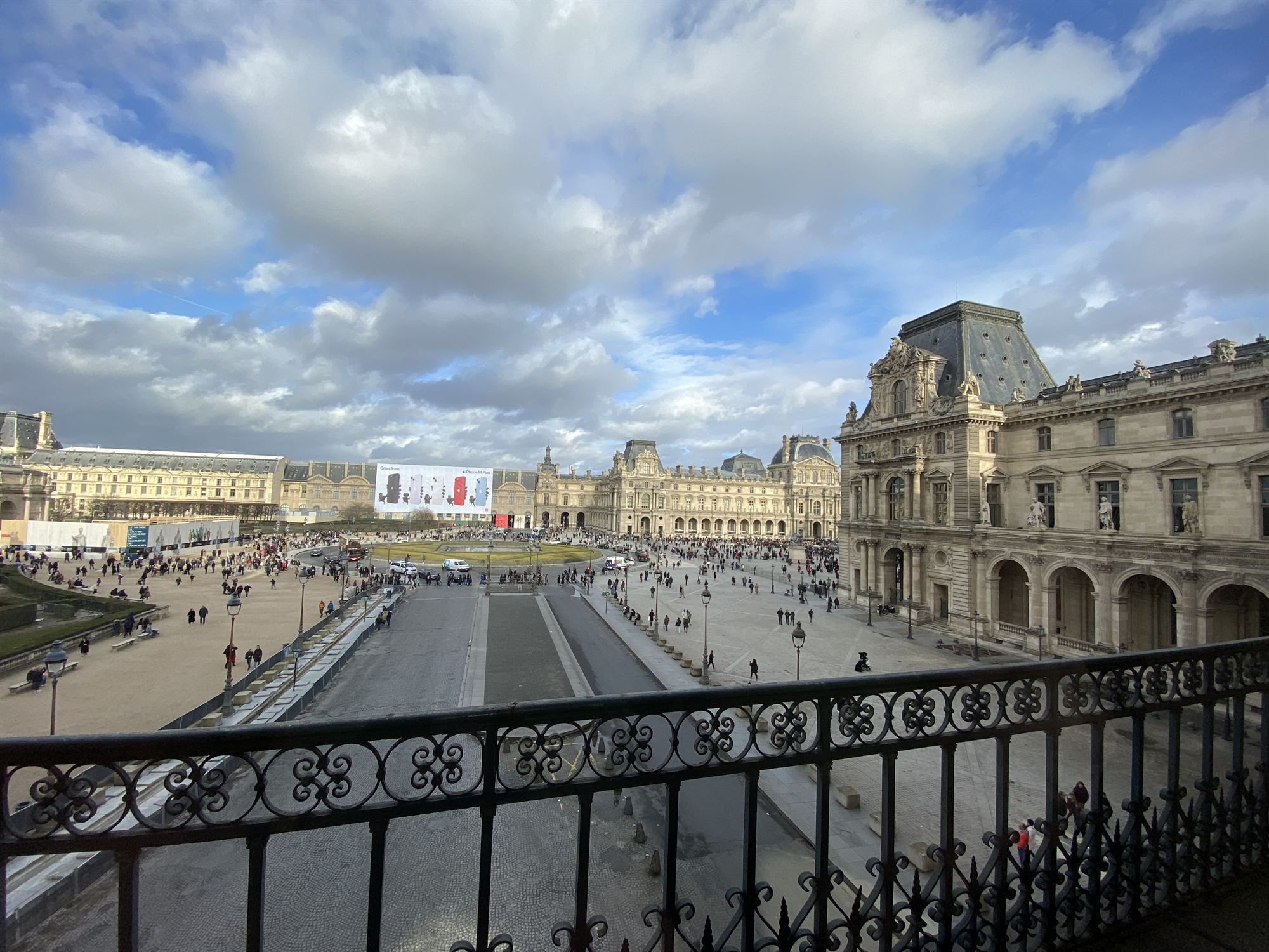 The Louvre's courtyard and pyramid, seen from a balcony above
