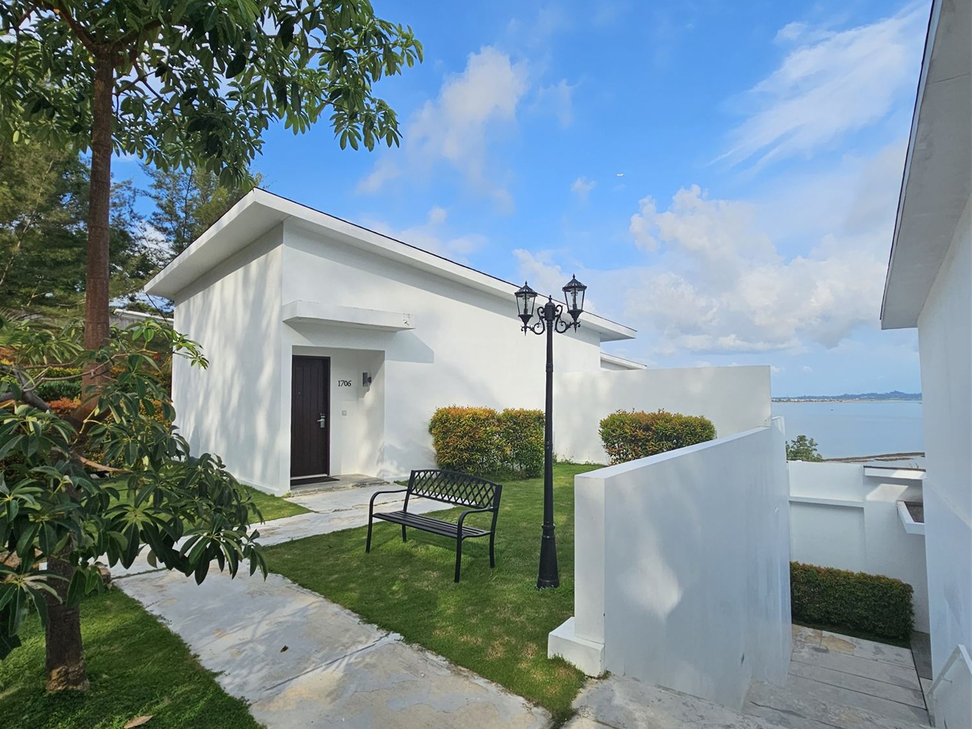 Villa exterior with garden bench at Montigo Resort, Batam