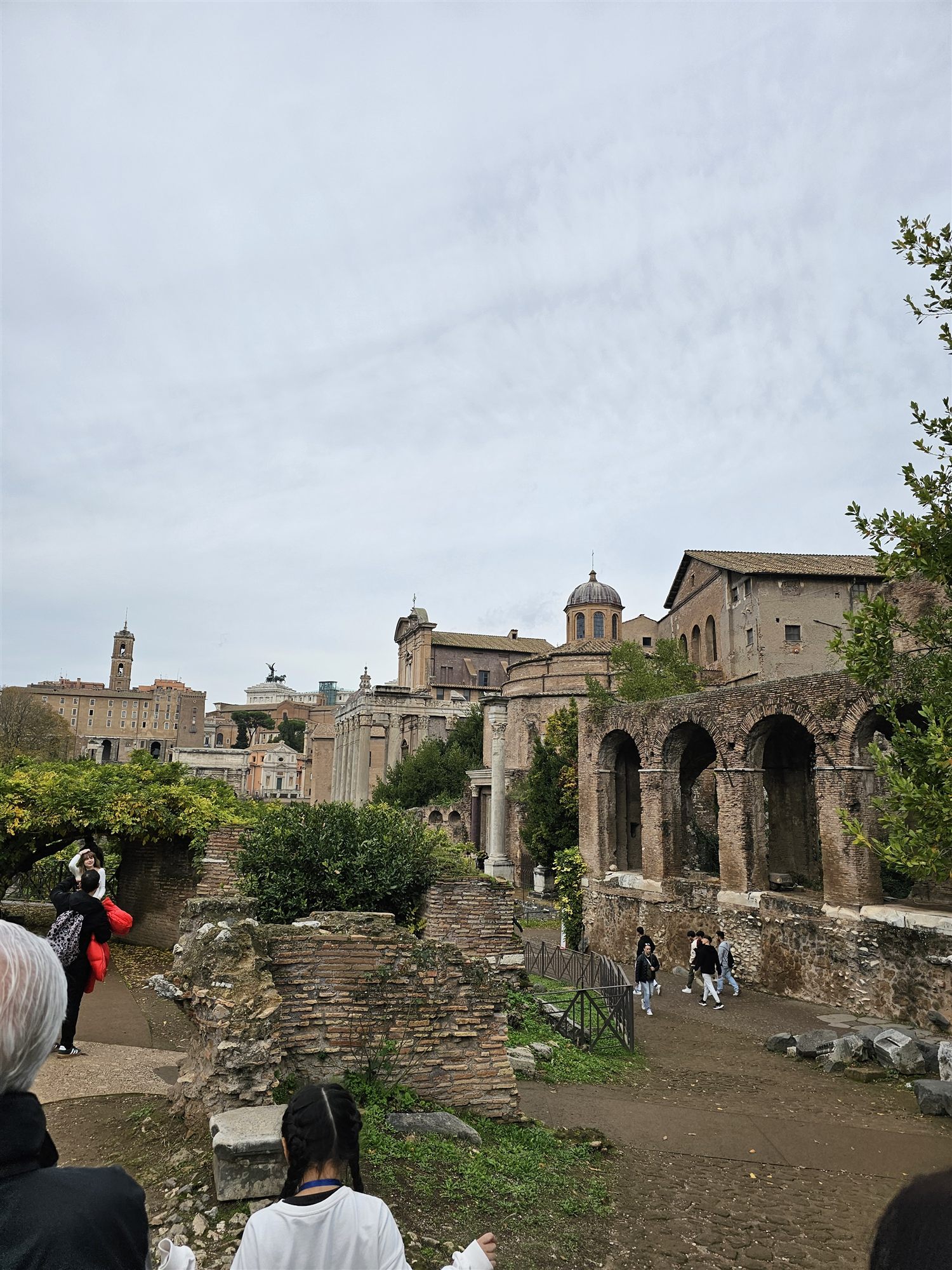 The Forum seen from the path, the Temple of Antoninus and Faustina's columns and the church beside it