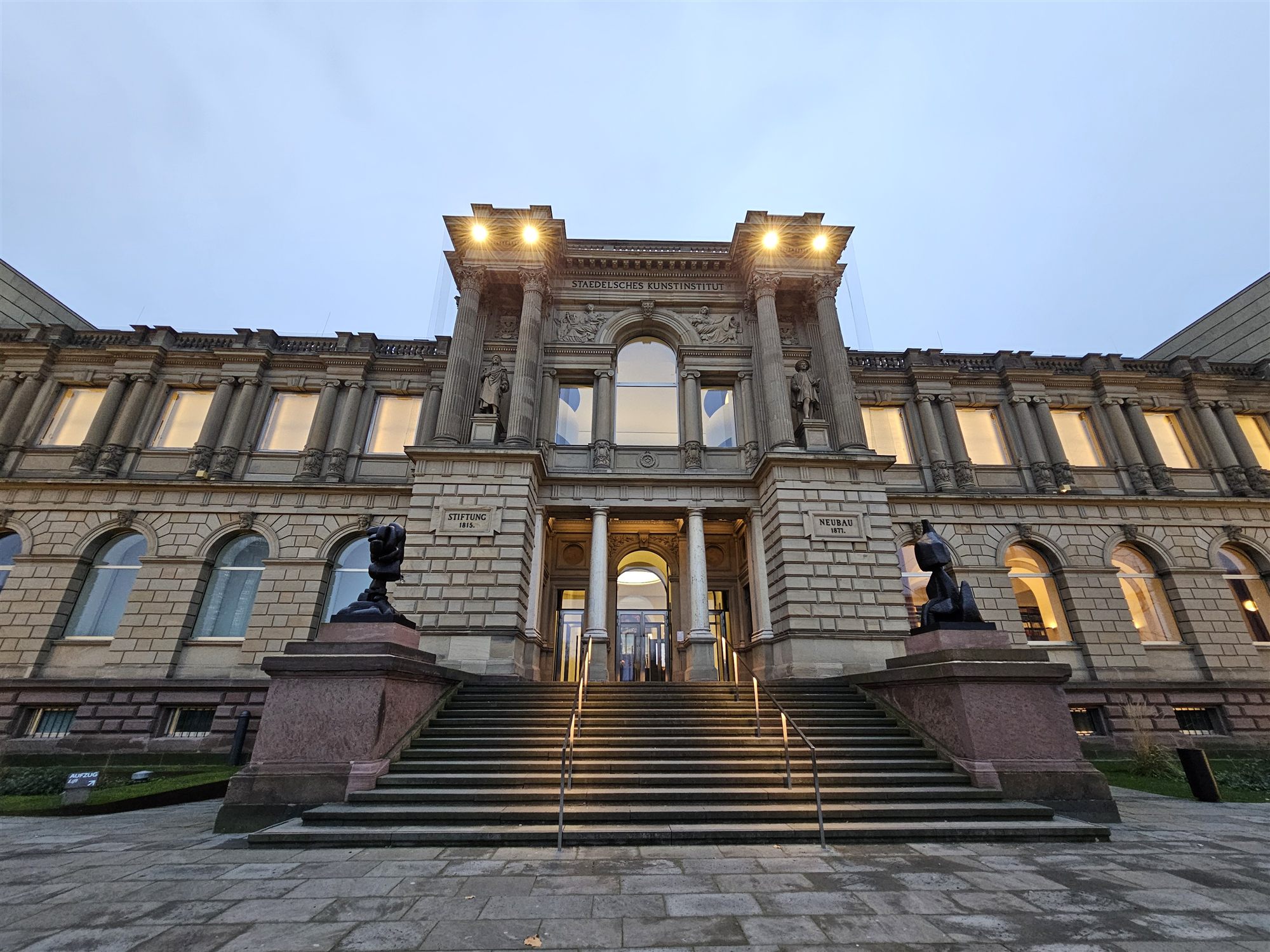 The Städel Museum's columned entrance facade, Frankfurt, lit in the evening