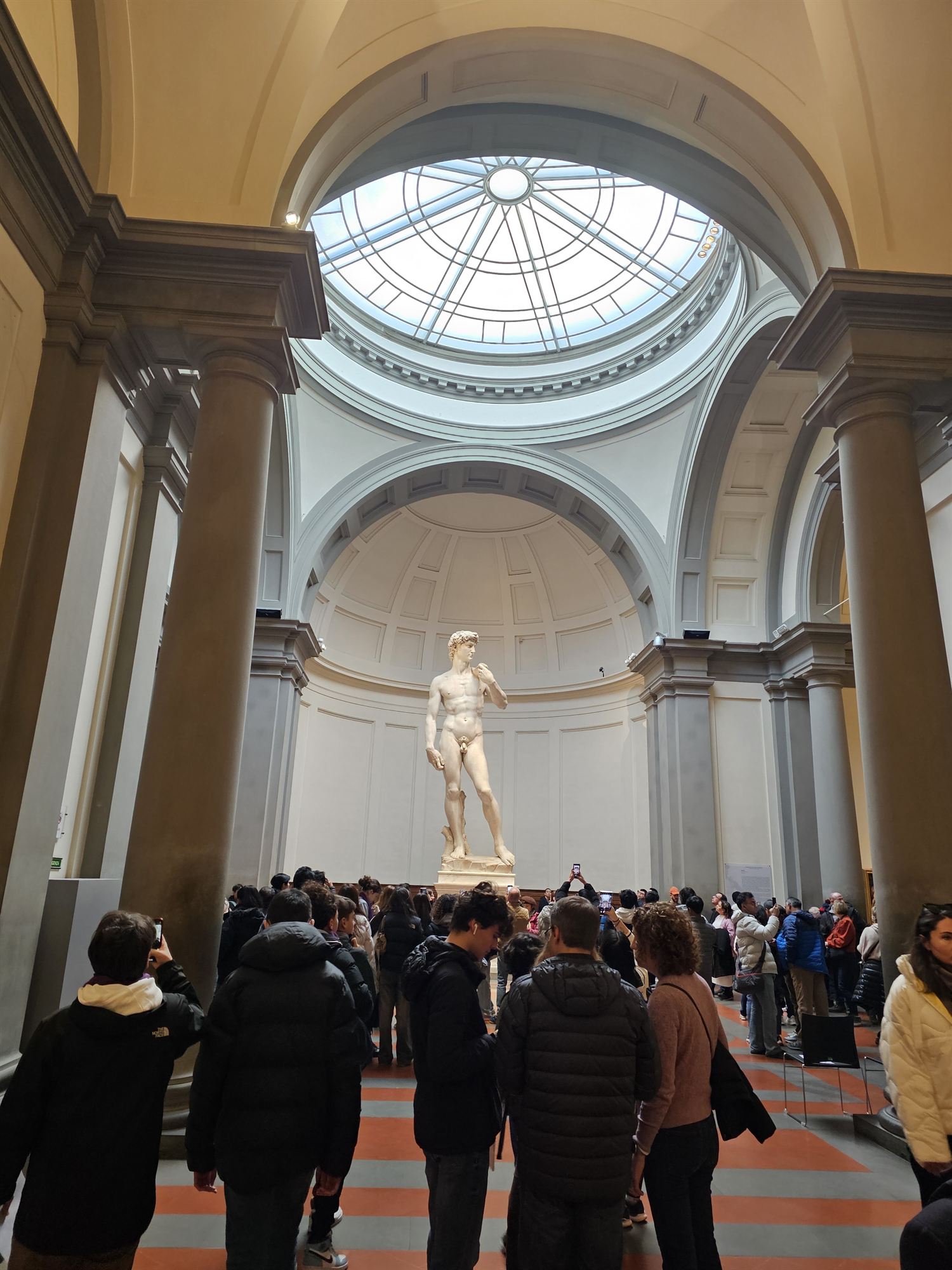 Michelangelo's David standing under the skylight of the Galleria dell'Accademia's rotunda