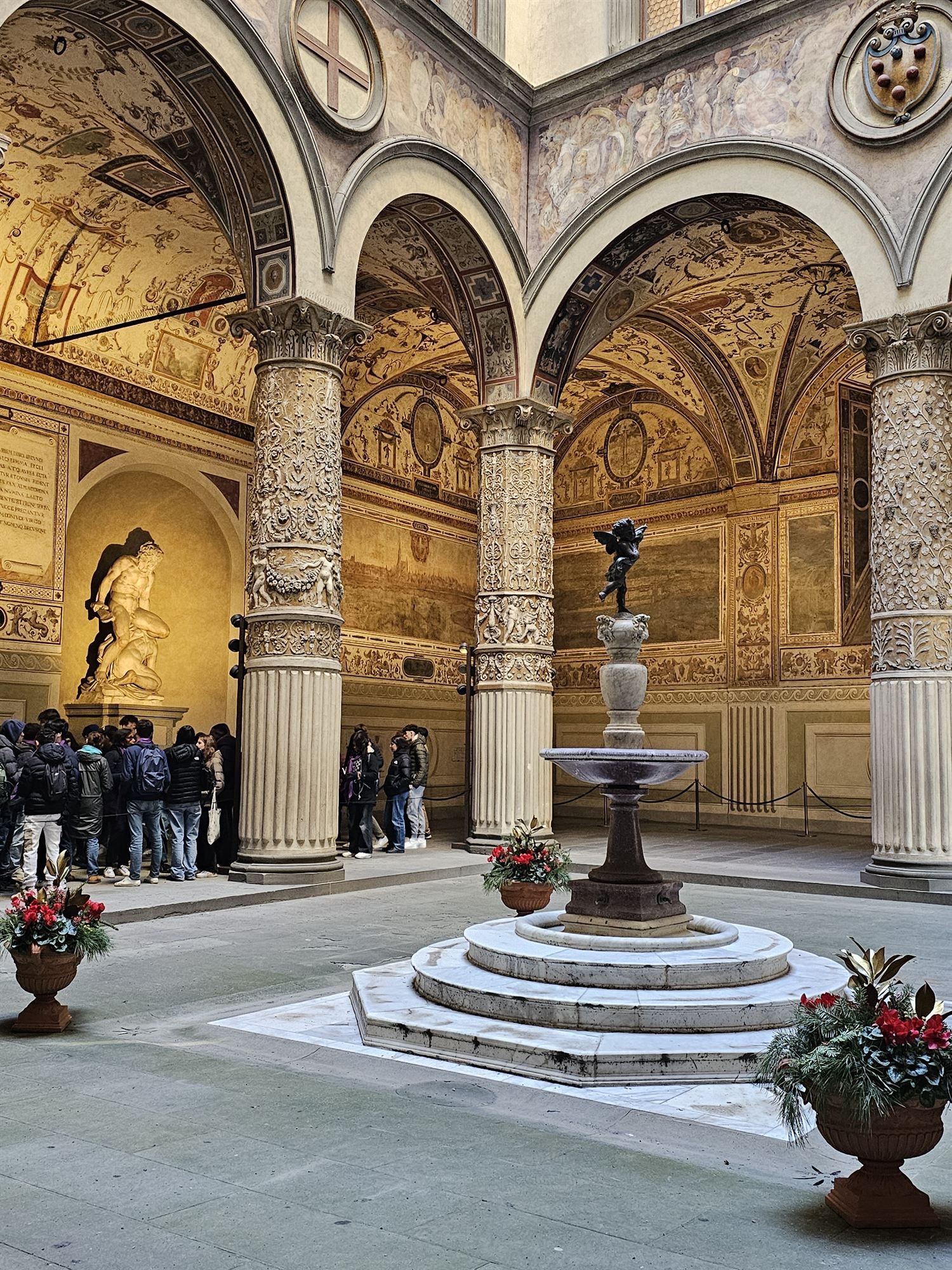 The Loggia dei Lanzi's open-air gallery of sculpture, Florence, with a Hercules statue and fountain