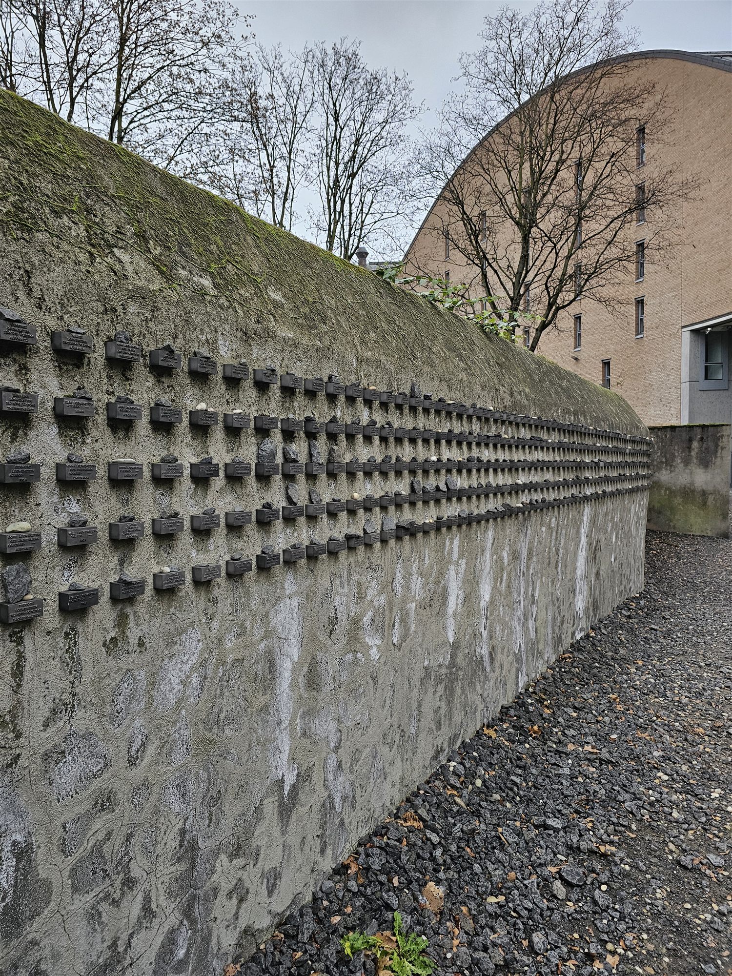 The New Börneplatz Memorial wall in Frankfurt, lined with bronze blocks bearing the names of Jewish Frankfurt residents killed in the Holocaust