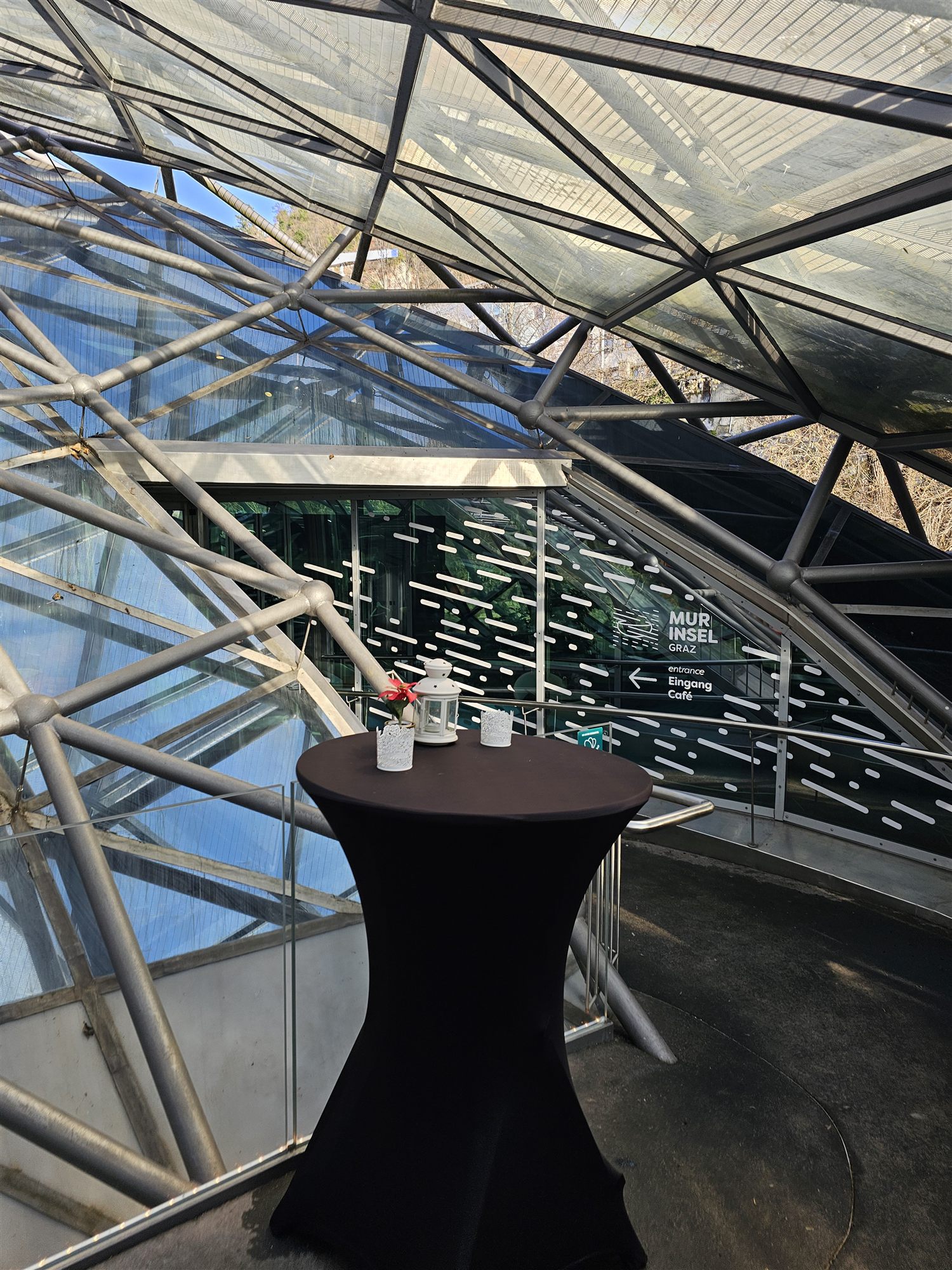 Steel-and-glass dome structure inside the Murinsel platform, Graz