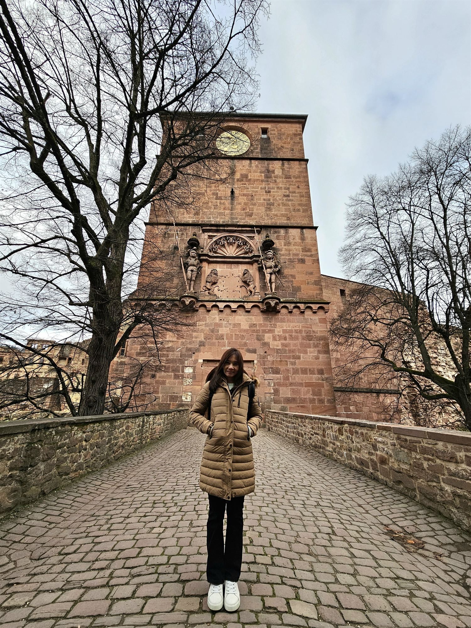 The old drawbridge and gate tower of Heidelberg Castle, guarded by carved knight statues