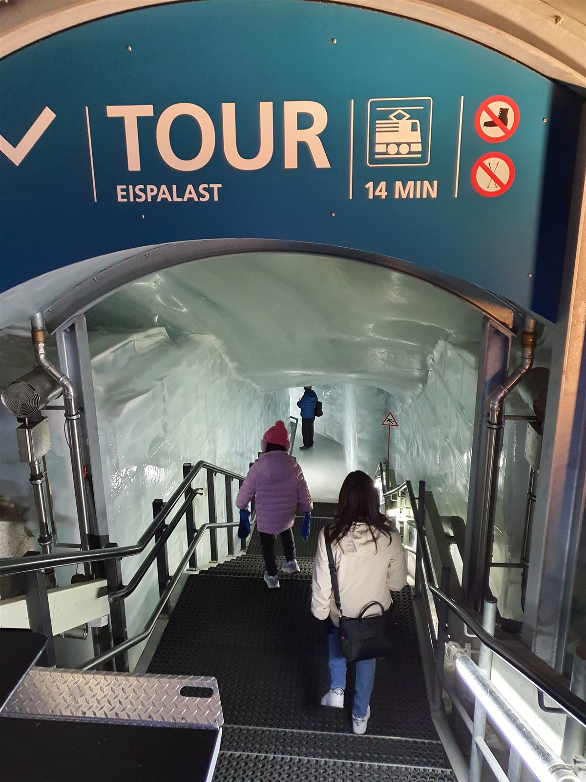 The Eispalast tour entrance sign and stairs leading down into the ice tunnel