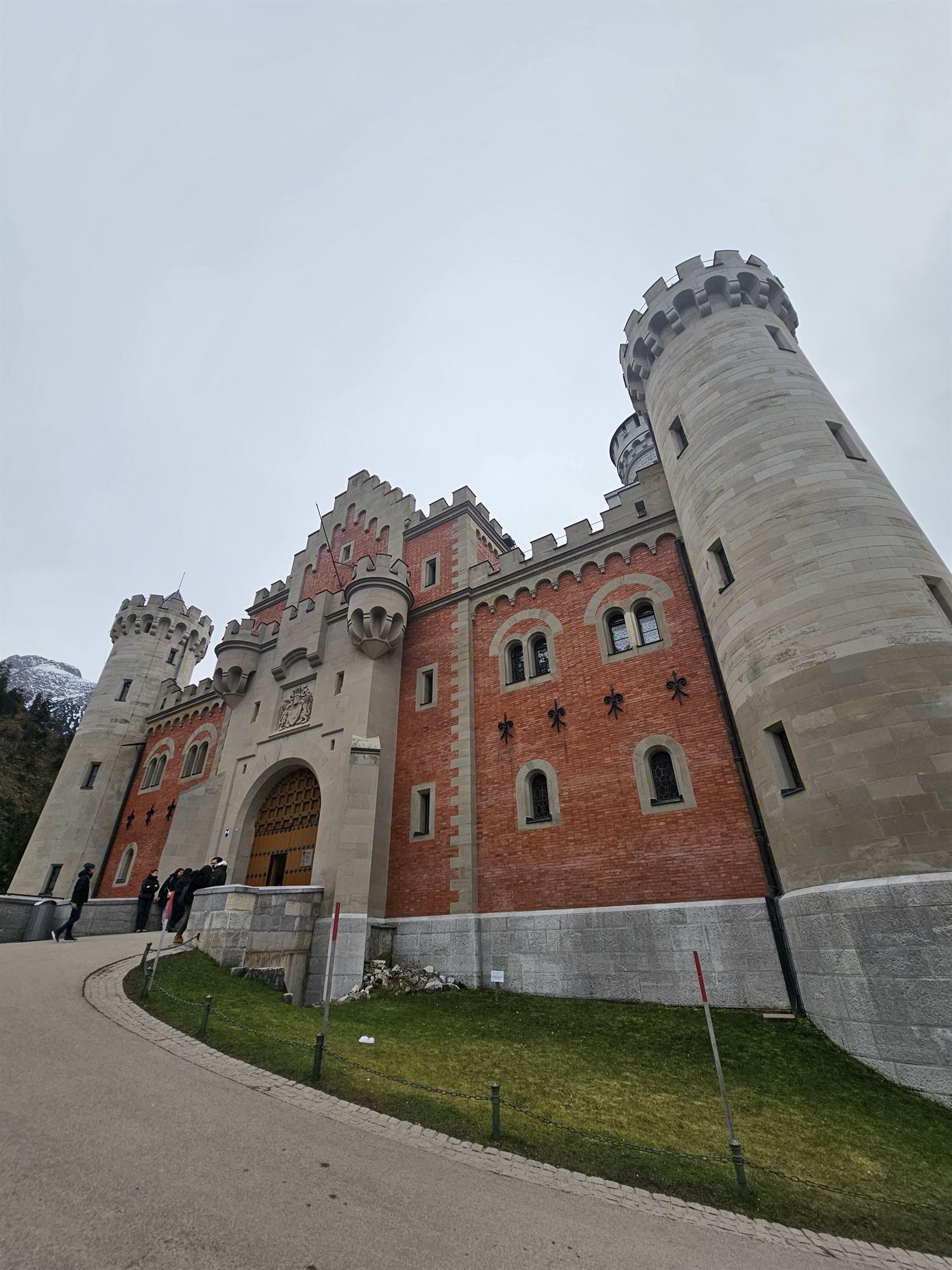 The red-brick gatehouse entrance to Neuschwanstein Castle, Bavaria