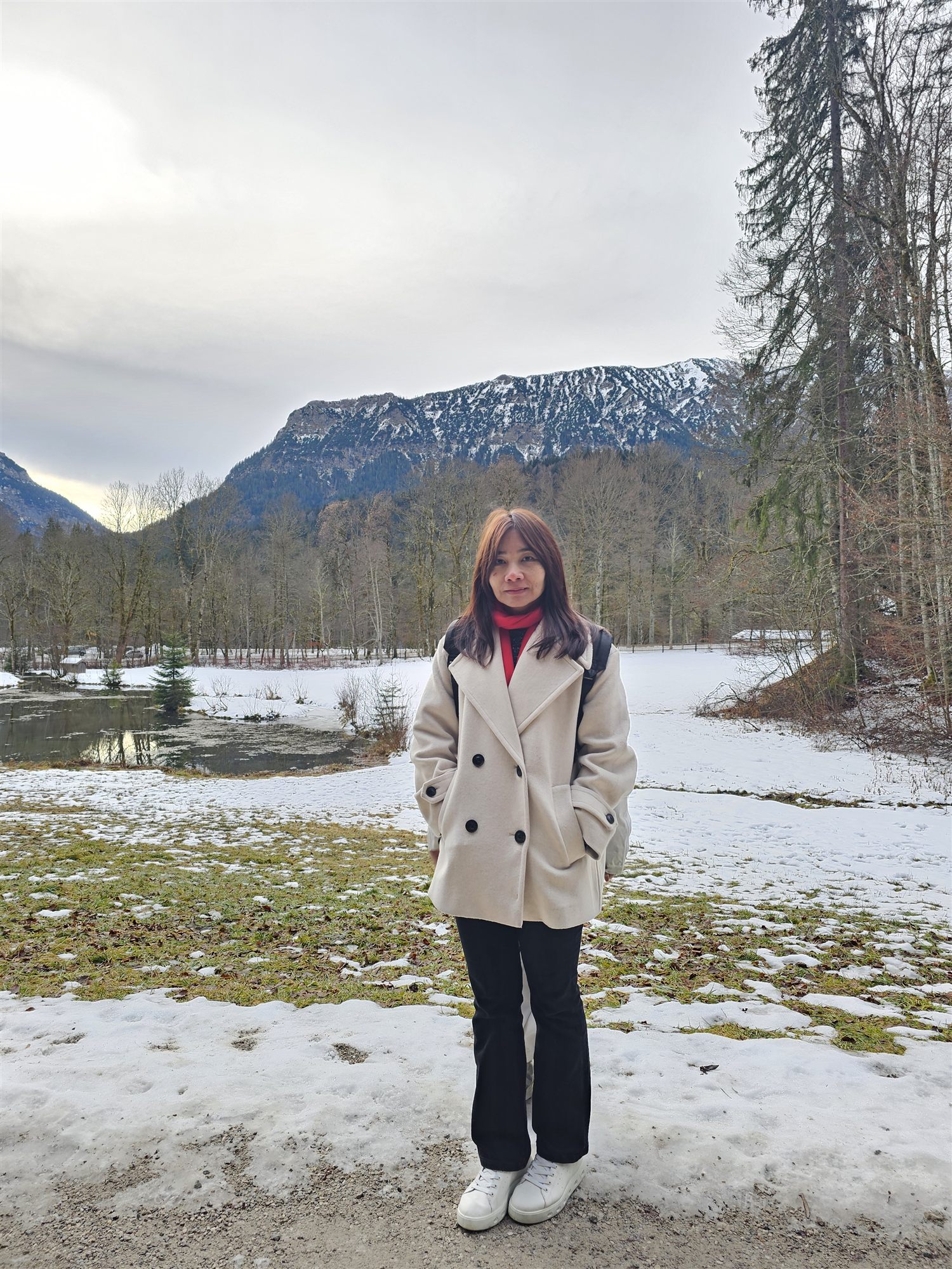 A snowy mountain ridge and a frozen pond in the Bavarian Alps near Linderhof