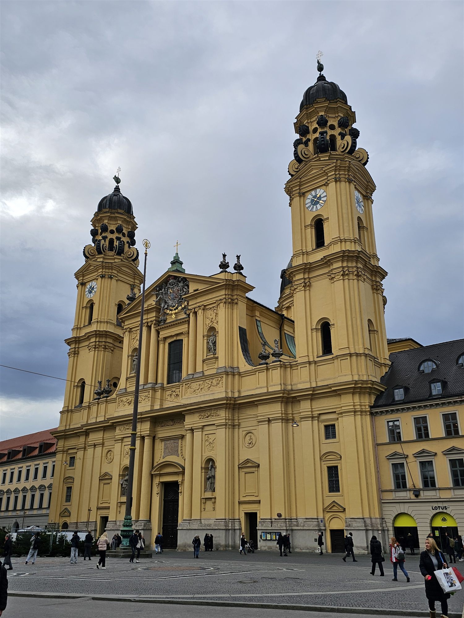 The yellow baroque Theatinerkirche with its twin towers, Odeonsplatz, Munich