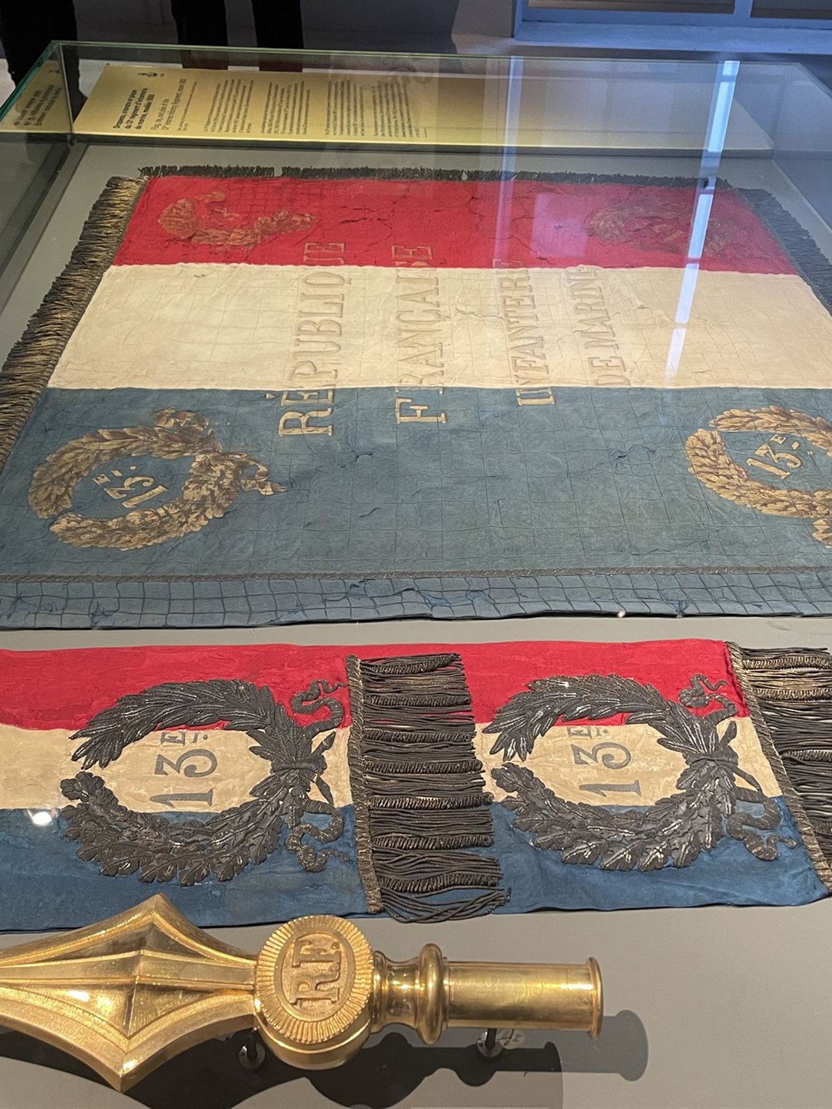 Historic French regimental flags on display at Musée de l'Armée