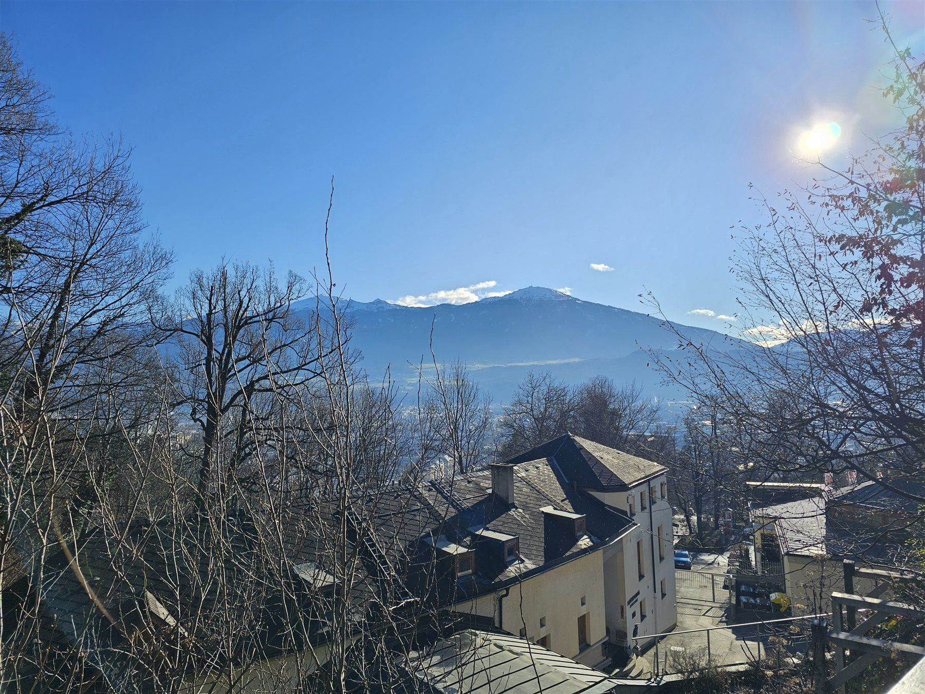 Innsbruck and the Inn Valley seen from within Alpenzoo, snow-capped mountains behind