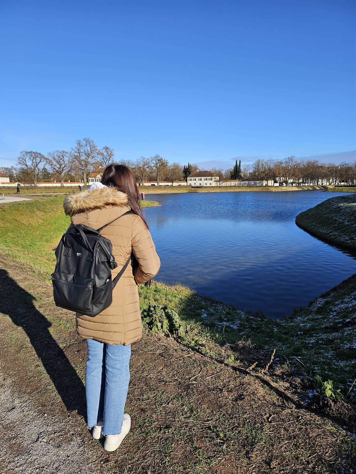 Standing by the lake at Nymphenburg Palace, looking out over the water