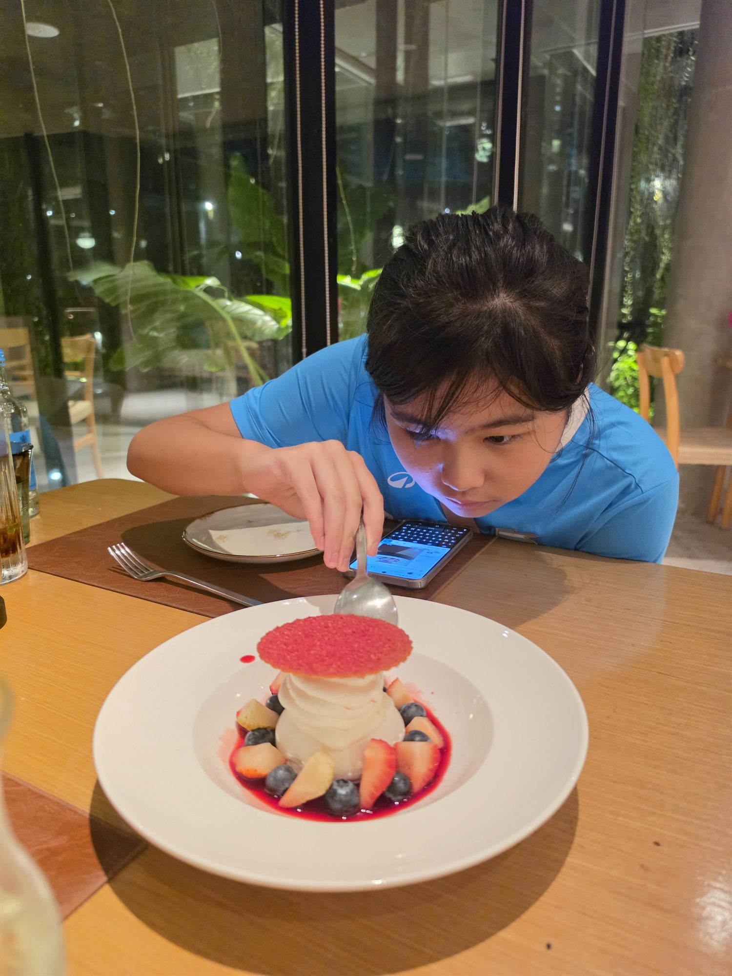 Child enjoying dessert at Lancava restaurant, PARKROYAL Langkawi