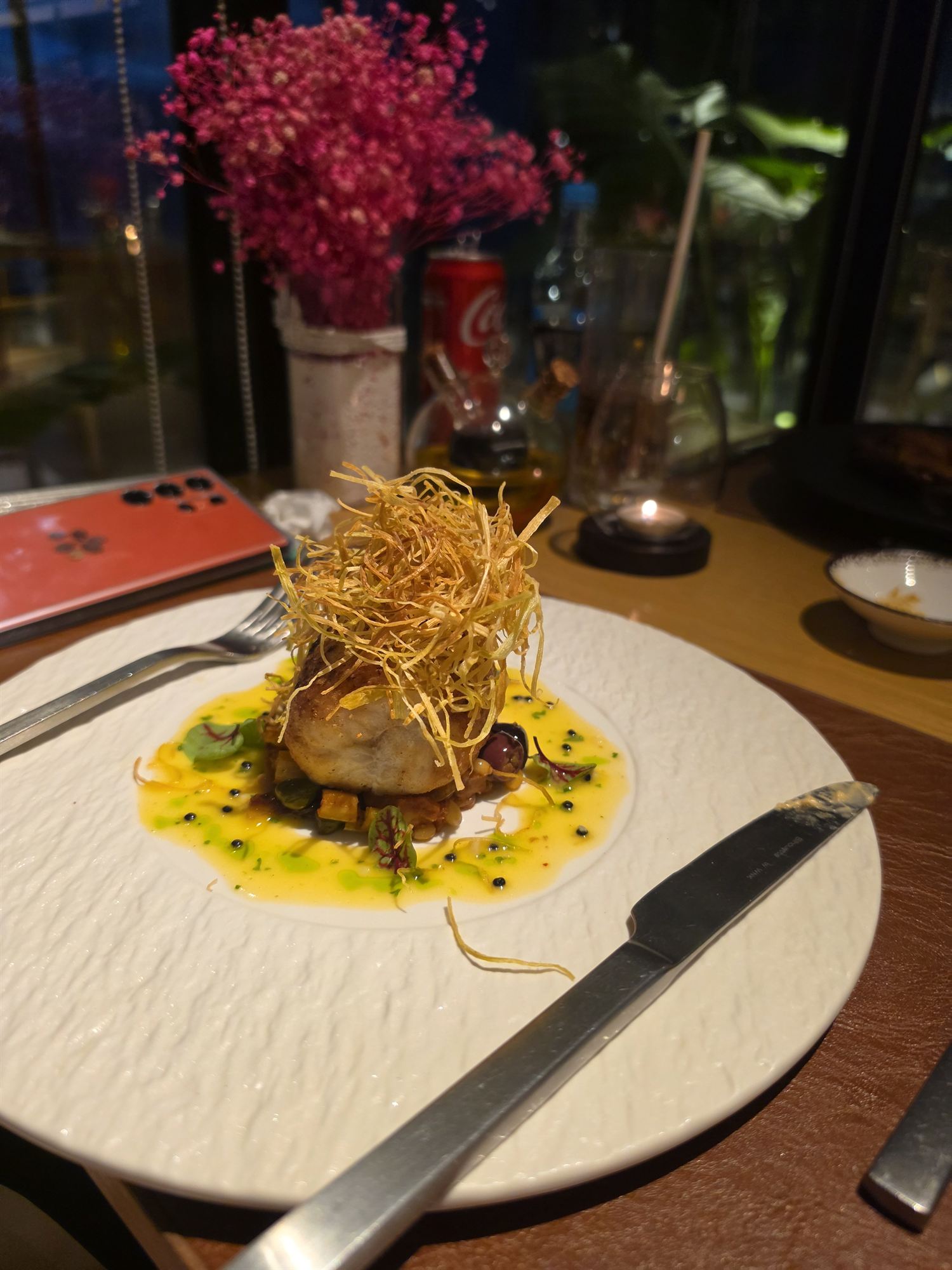 Fish dish with crispy potato garnish at Lancava restaurant, PARKROYAL Langkawi