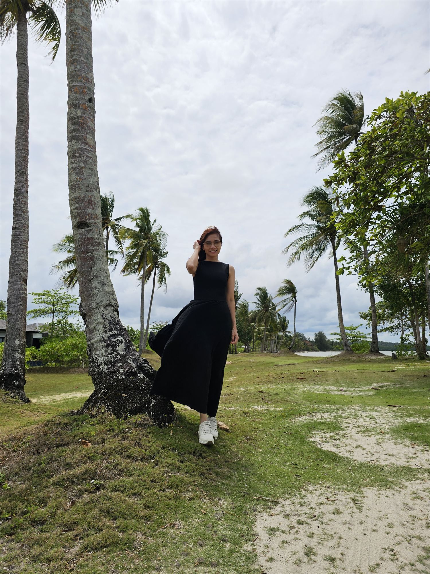Evening walk among the palm trees at The Residence Bintan