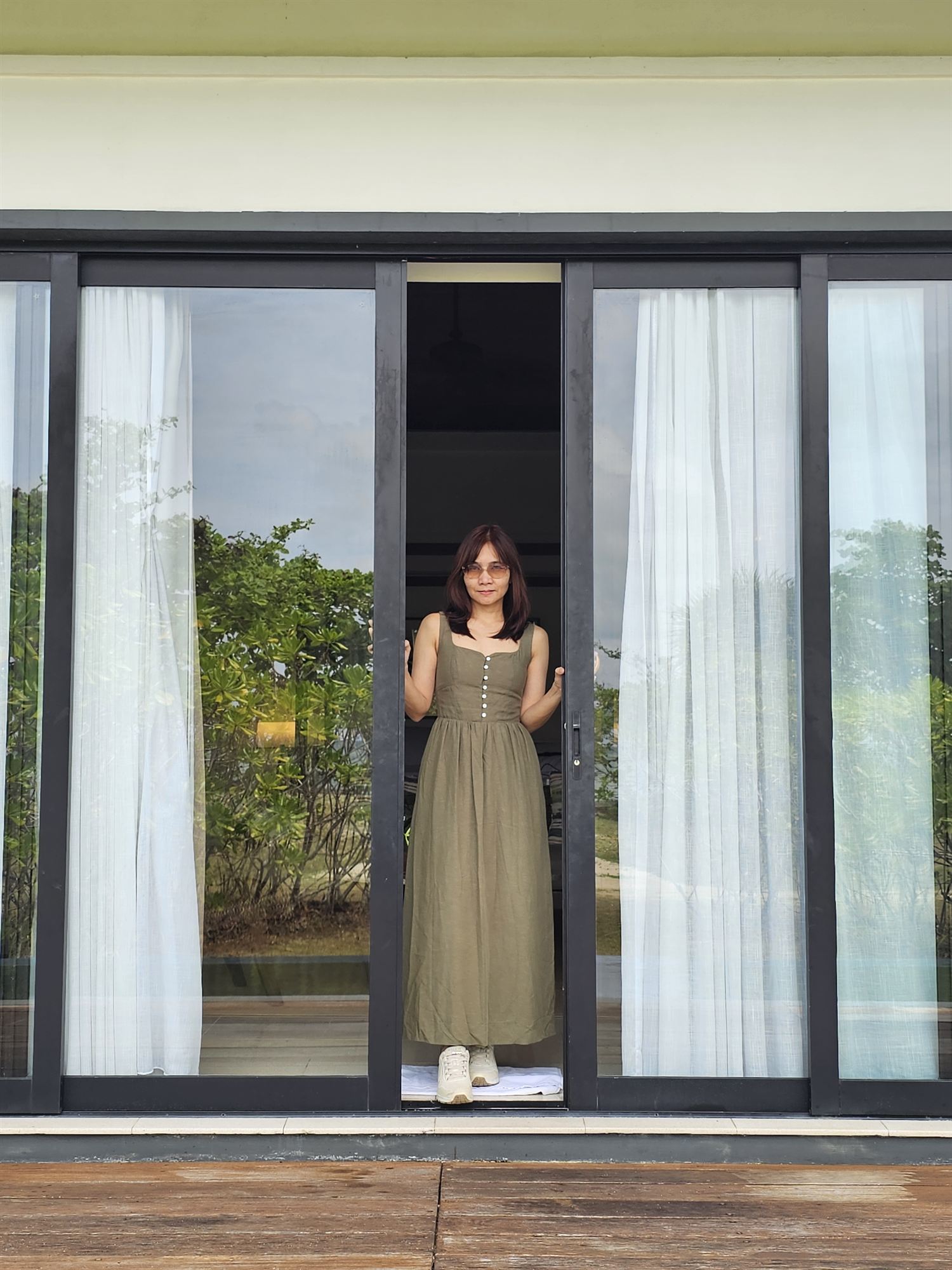 Standing in the villa doorway at The Residence Bintan