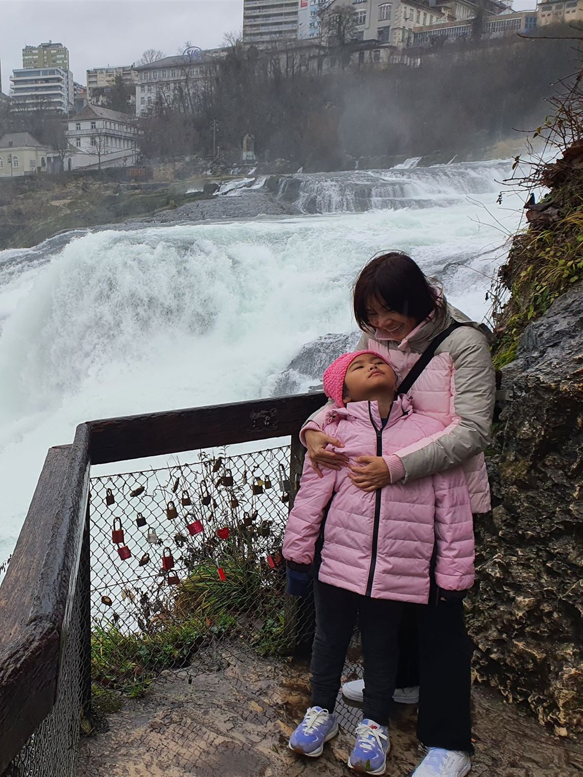 Mother and daughter at the Rhine Falls love-lock fence
