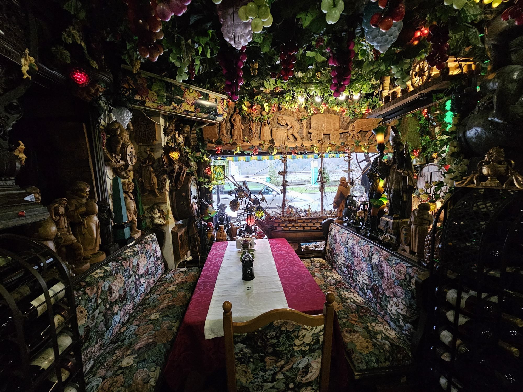Inside the whimsical Rhine Valley restaurant, decorated with grapevines and a model ship