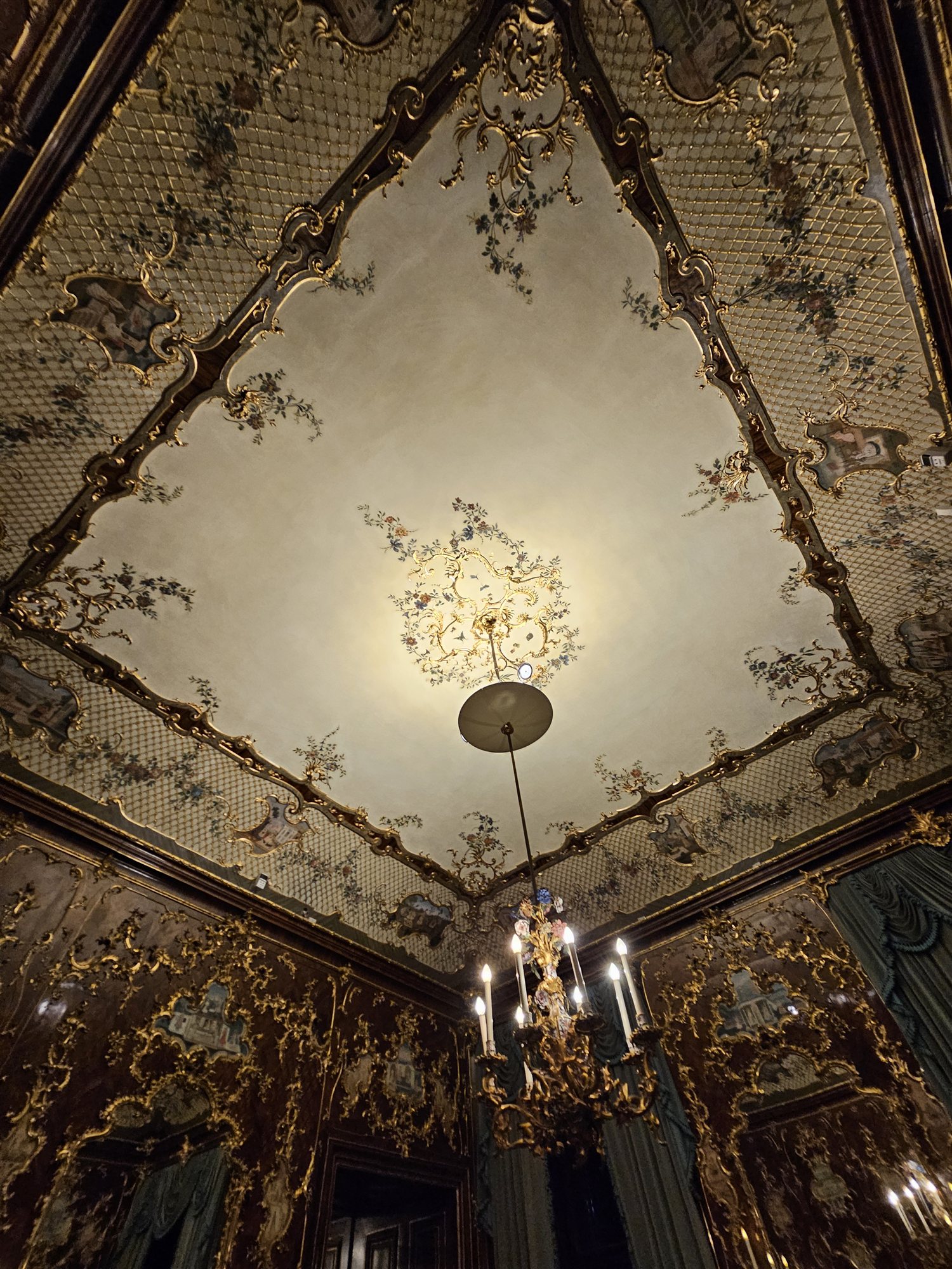Close-up of the Great Gallery's ceiling fresco at Schönbrunn Palace, gilded frame and painted figures