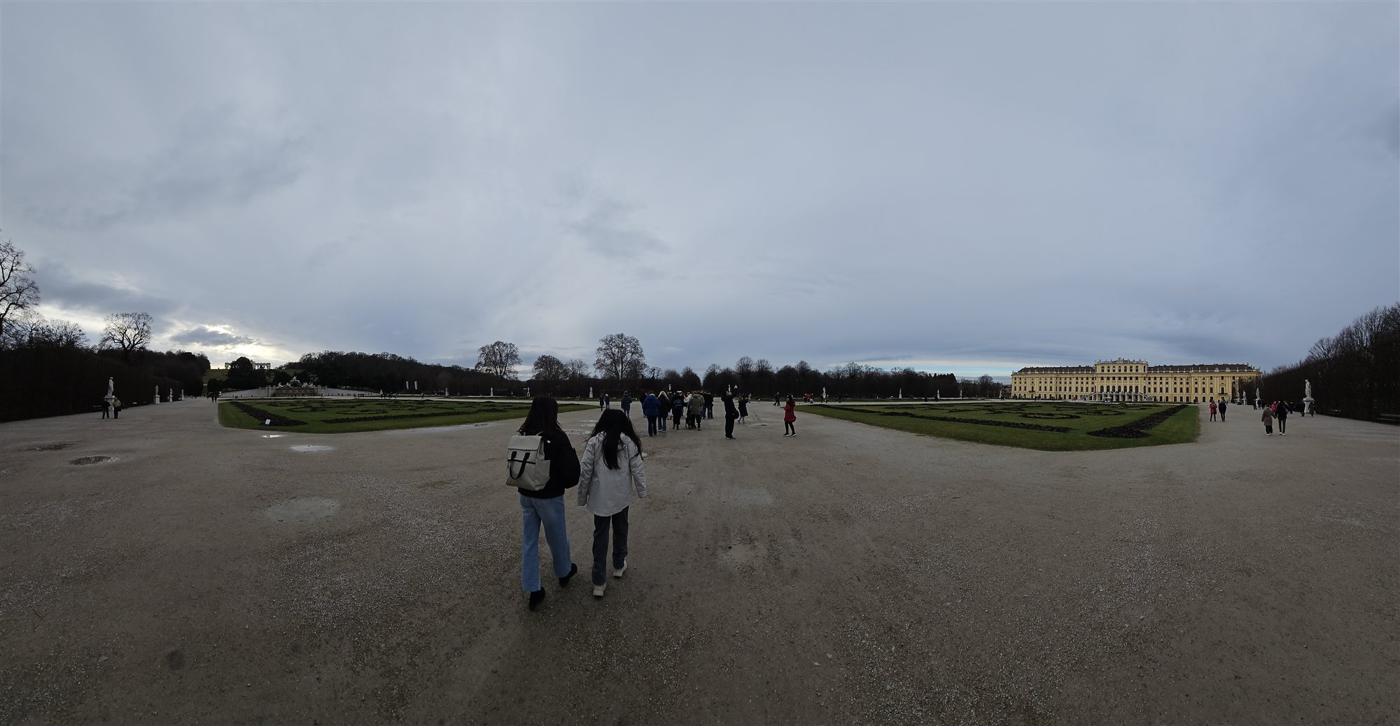 Panoramic view of the gardens and the Sch&ouml;nbrunn Palace facade at dusk