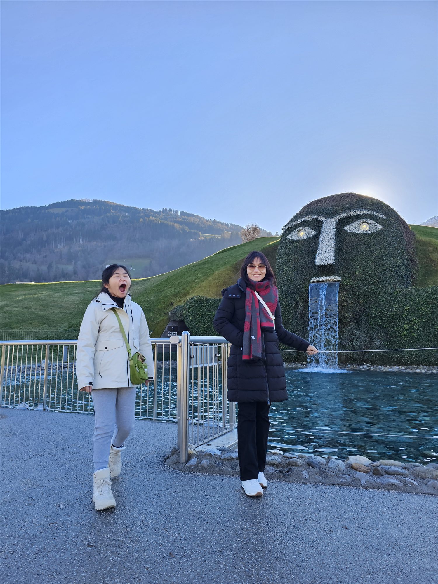 The Giant, a grass-covered face fountain at the entrance to Swarovski Crystal Worlds