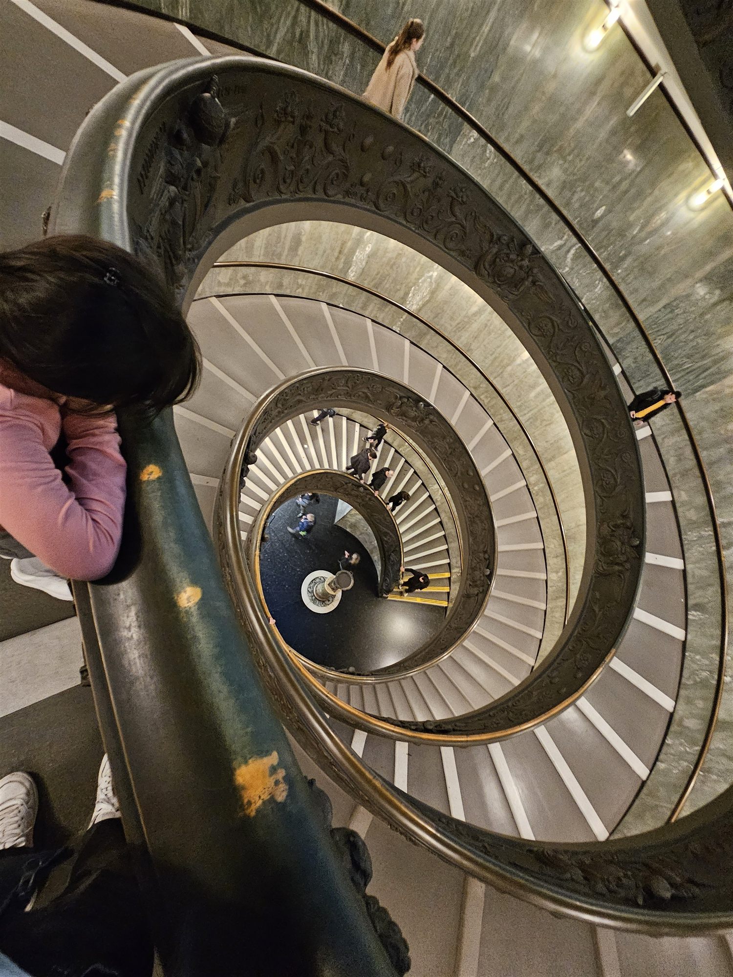 The double-helix Bramante Staircase at the Vatican Museums, seen from above with visitors descending