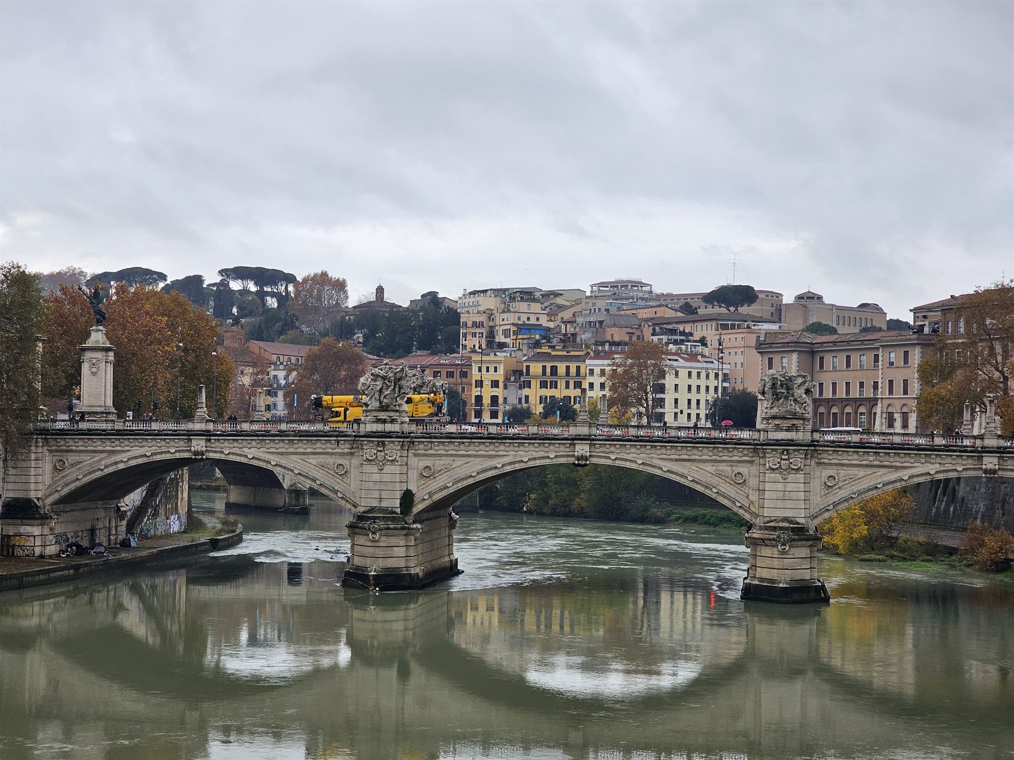 A stone bridge over the Tiber River, Rome