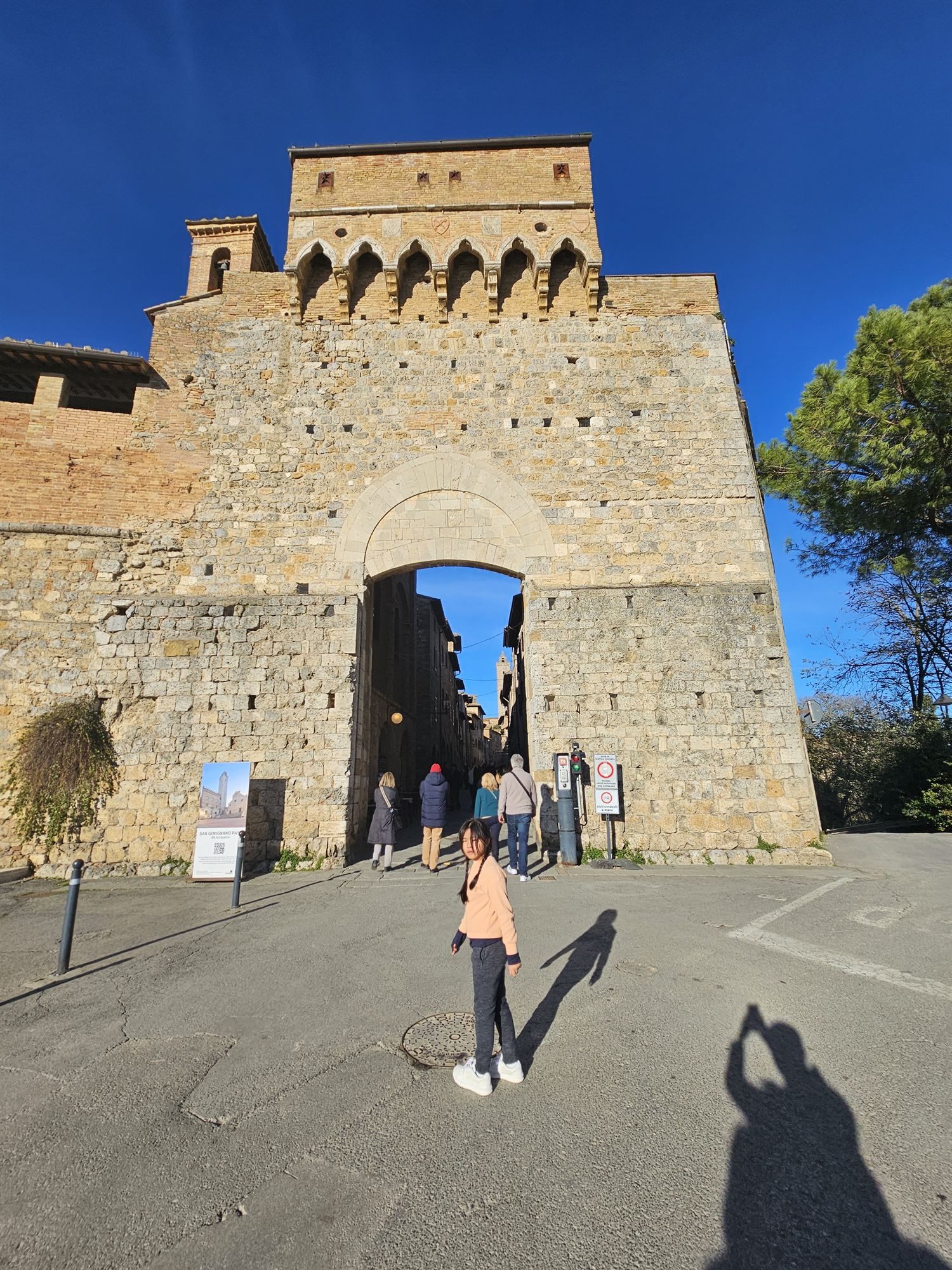 Walking through the Porta San Giovanni gate into San Gimignano's walled old town