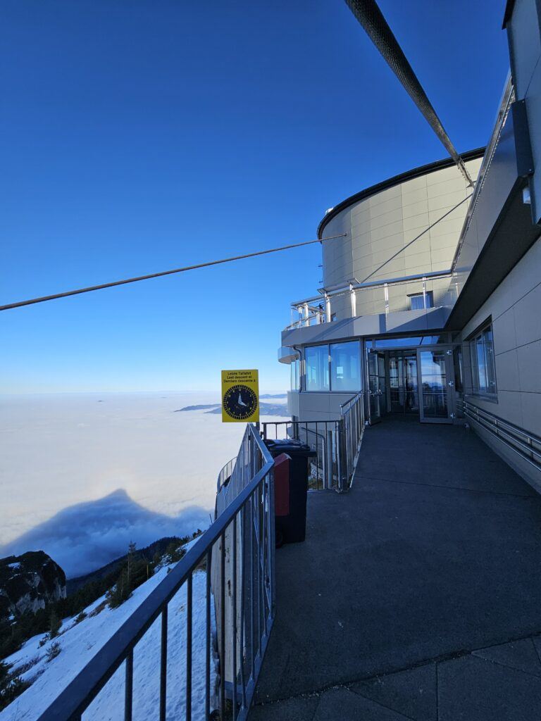 The mountaintop restaurant at Untersberg summit, perched above a sea of clouds