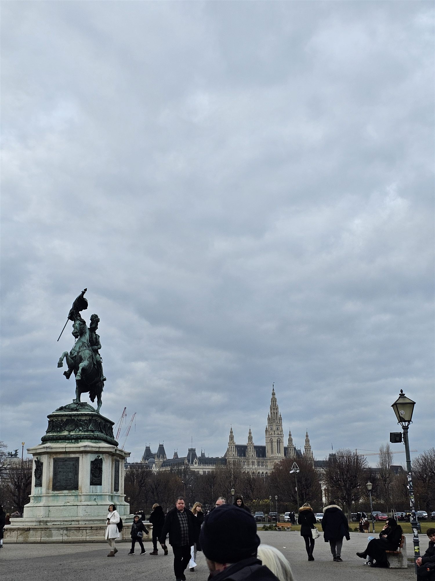 Statue of Prince Eugene of Savoy at Heldenplatz, with Vienna's Rathaus visible in the distance