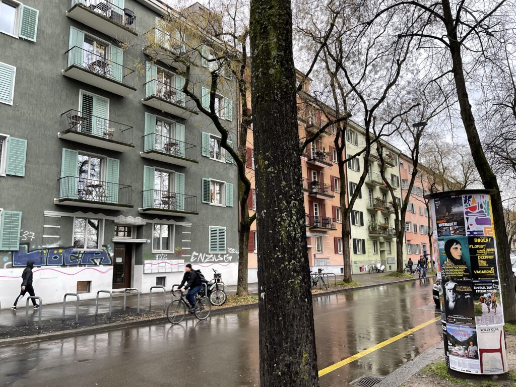 quiet residential street in zurich with pastel buildings