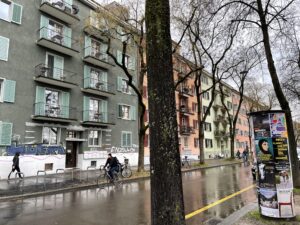 quiet residential street in zurich with pastel buildings